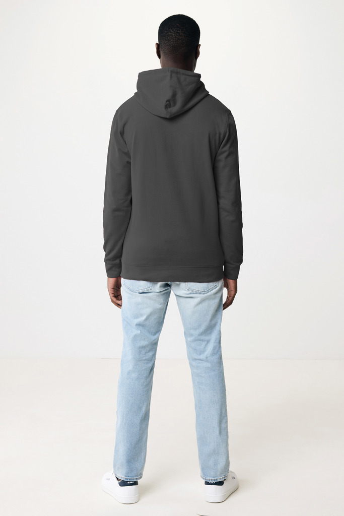 Personne portant sweat gris et jean clair dos tourné