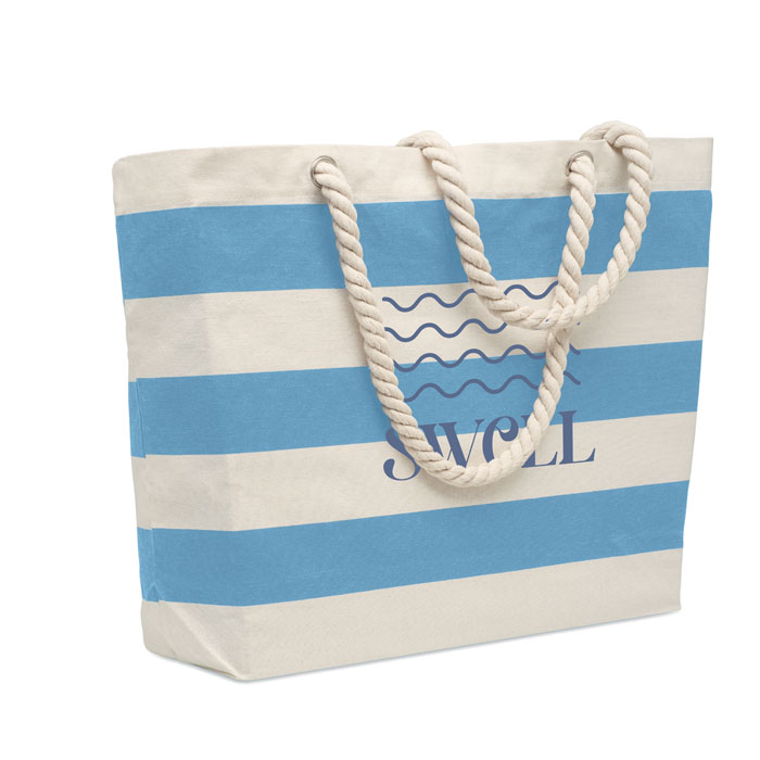 Sac de plage rayé bleu et blanc.