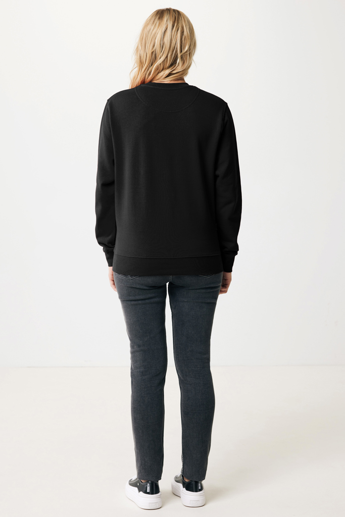Vue arrière femme sweat noir et jean